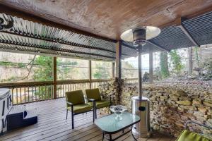 a screened in porch with two chairs and a table at Hot Tub, Trails, Views! Little River Retreat in Sunshine