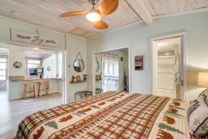 a bedroom with a bed and a ceiling fan at Hot Tub, Trails, Views! Little River Retreat in Sunshine