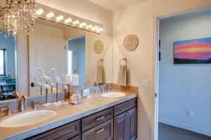 a bathroom with two sinks and a large mirror at Stunning 360 Ocean Views, Near Redwoods NP! in Smith River +18 photos