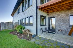 a house with a patio and a fence at Stunning 360 Ocean Views, Near Redwoods NP! in Smith River