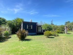 En have udenfor Hermosa Cabaña Con Parque Cerca Del Mar