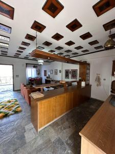 a living room with a couch and a table at Kokkotis Residence in Samarina