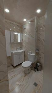 Koupelna v ubytování Хотел-ресторант Астория