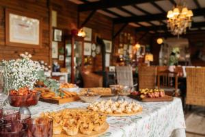 a table with plates of food on top at Casa Da Avó - Vale da Silva Villas in Albergaria-a-Velha