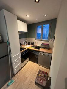 a kitchen with a sink and a counter top at Gite du Lac Pavin in Besse-et-Saint-Anastaise