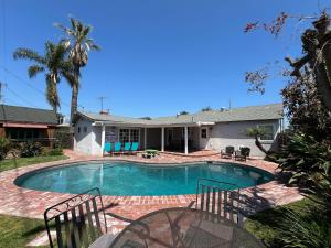 a swimming pool in the backyard of a house at Destination #13 in Anaheim