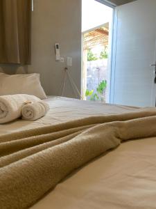 Postel nebo postele na pokoji v ubytování Aratu Pousada