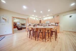 a kitchen with a large wooden table and bar stools at Family and Pet Friendly! 7-Acre Escape in Jefferson in Jefferson