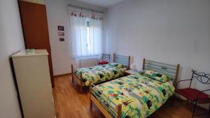 Postel nebo postele na pokoji v ubytování Stella Marina