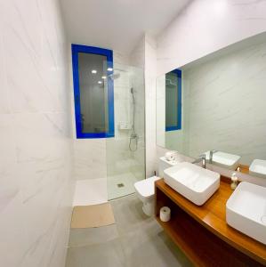 a bathroom with a toilet and a sink and a shower at playa honda airport suite in Playa Honda +31 photos
