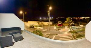 a view of a parking lot at night at playa honda airport suite in Playa Honda