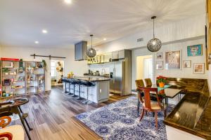 a kitchen and dining room with a table and chairs at Pet-Friendly Group Getaway 12 Mi to Camelback Mtn! in Mountainhome