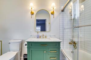 a bathroom with a green cabinet and a mirror at Pet-Friendly Group Getaway 12 Mi to Camelback Mtn! in Mountainhome +27 photos