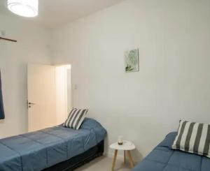 Ένα ή περισσότερα κρεβάτια σε δωμάτιο στο Hostel Suite DDT