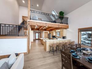 a dining room and kitchen in a log home at Lakefront Beauty in Rocky Point