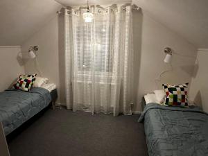 Ένα ή περισσότερα κρεβάτια σε δωμάτιο στο Good House Transtrand Sälen +8 φωτογραφίες