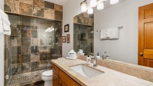 a bathroom with a sink and a toilet at Riverside Condos C202 by AvantStay Condo Close To Downtown Town Park Ski Lift 8 in Telluride +11 photos