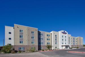 a hotel building with a street in front of it at Candlewood Suites Roswell by IHG in Roswell