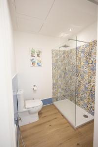 a bathroom with a toilet and a glass shower at Trapani Rooms 155 Self Check in in Trapani +12 photos