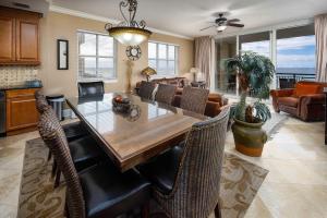 a dining room with a table and chairs at Bella Riva 301 Large Gulf Front condo in Fort Walton Beach