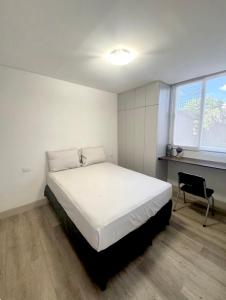 Postel nebo postele na pokoji v ubytování Apartment 319 Ecodistrito - ZonaPRO