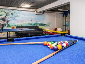 a billiard room with a pool table with balls at 4 star holiday home in Hejls in Hejlsminde