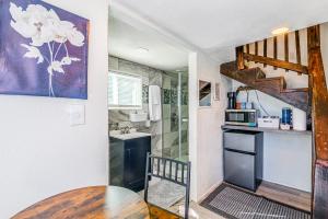 a small kitchen with a table and a sink at Tiny Home with a Huge View in Ruidoso +14 photos
