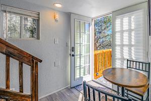 a dining room with a table and a window at Tiny Home with a Huge View in Ruidoso
