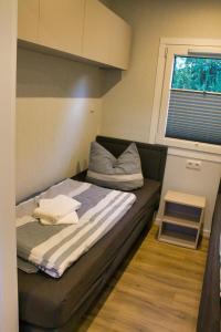 Ένα ή περισσότερα κρεβάτια σε δωμάτιο στο Ferienhaus Noa