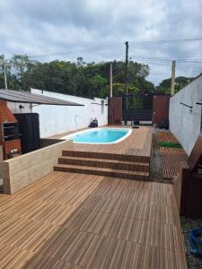 Πισίνα στο ή κοντά στο Casa Boraceia Litoral Norte SP