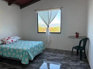 Postel nebo postele na pokoji v ubytování Luisa Rodriguez + 6 fotografií