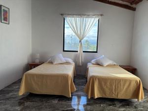 Postel nebo postele na pokoji v ubytování Luisa Rodriguez