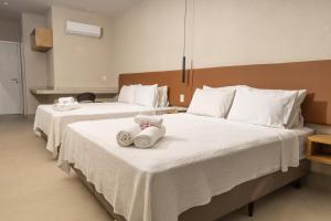 Ένα ή περισσότερα κρεβάτια σε δωμάτιο στο Sereno Hotel