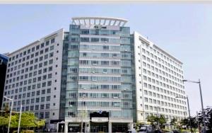 a large building with a sign on the top of it at Cozy - Bright Studio in Incheon