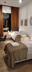 Ένα ή περισσότερα κρεβάτια σε δωμάτιο στο Drzewna Apartamenty-Wojska Polskiego +105 φωτογραφίες