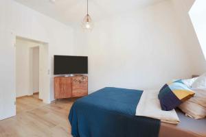 Ένα ή περισσότερα κρεβάτια σε δωμάτιο στο Hauts-de-Seine Meudon