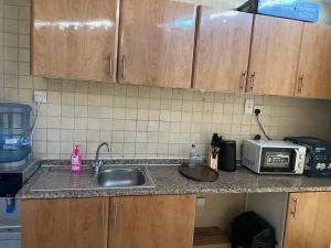 Køkken eller tekøkken på ALFUTTAIN Vacation Homes Rental