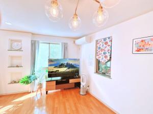 Postel nebo postele na pokoji v ubytování Ikebukuro area, three layer house, double subway,5 min walk to stn, 双地铁车站步行5分 直达新宿 涩谷 银座 池袋 皇居 可免费停车 最大10人