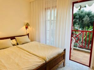 Ένα ή περισσότερα κρεβάτια σε δωμάτιο στο Casa Heidi +36 φωτογραφίες