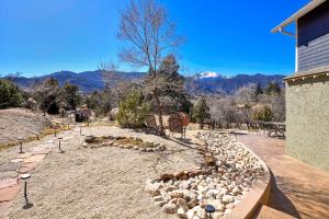 a flock of sheep in a yard next to a house at Peak View Guesthouse - Walk to Garden of the Gods - Hot Tub - Epic Views! in Colorado Springs