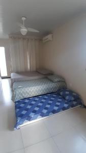 a small bedroom with a bed in the corner at Casa Ana y Ángelo in Pântano Grande +18 photos