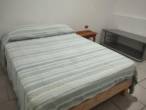 Ένα ή περισσότερα κρεβάτια σε δωμάτιο στο Cómoda Casa en el centro de Coatepec Veracruz