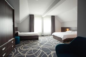 Posteľ alebo postele v izbe v ubytovaní Hotel Nad Nettą