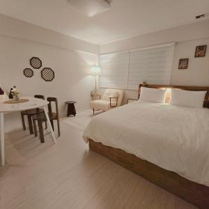 En eller flere senge i et værelse på Maro Stay Songpa