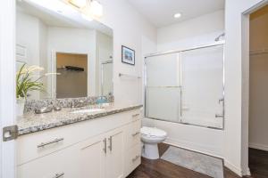 a bathroom with a toilet sink and a shower at Villa Hakuna Matata- Lucaya Village Resort in Kissimmee +32 photos