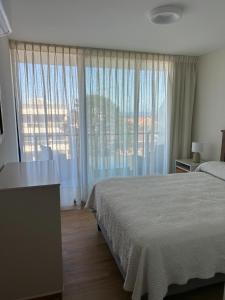 Postel nebo postele na pokoji v ubytování Apto en Playa Mansa cerca del mar Parada 22 + 11 fotografií