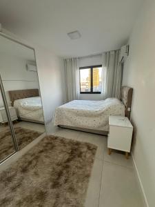 Ένα ή περισσότερα κρεβάτια σε δωμάτιο στο Apartamento Towers Centro Torres