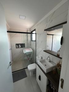 Koupelna v ubytování Apartamento Towers Centro Torres + 11 fotografií