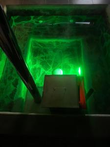 a green light in a tunnel with a box at Cabañas El Quincho de Putú in Constitución