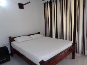 Katil atau katil-katil dalam bilik di Man Guest Polonnaruwa